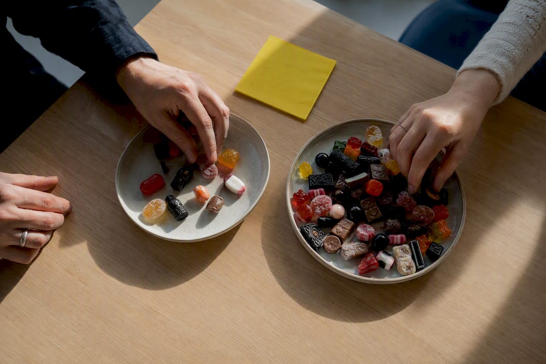 Anonymous Swedish candy comparison on dining table