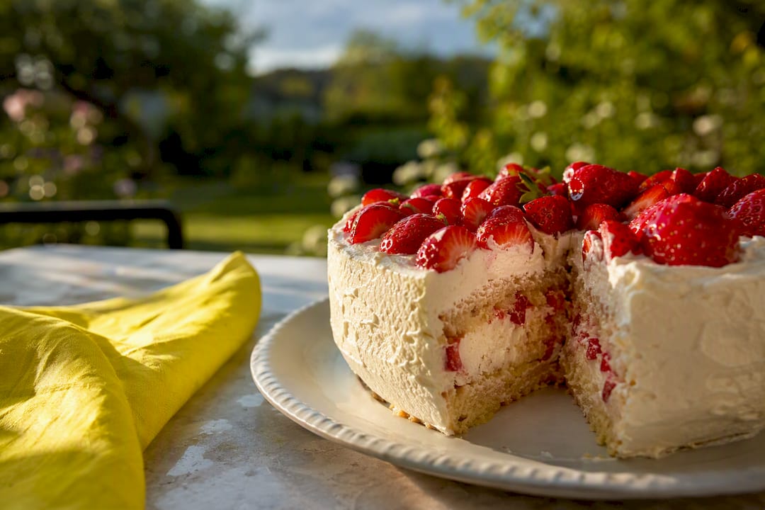 Midsummer strawberry cake with whipped cream