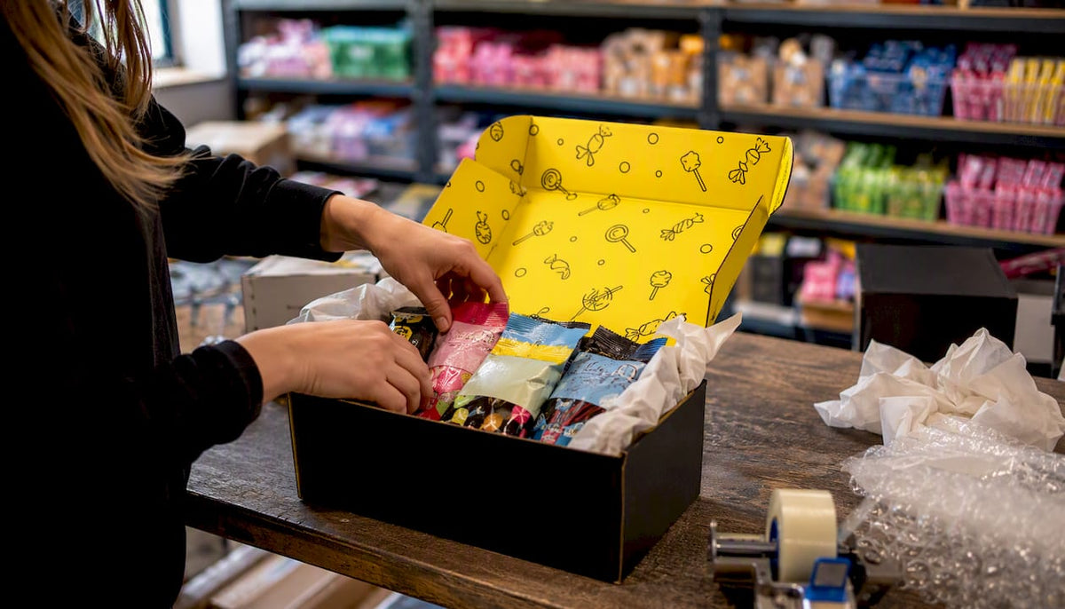 Packing Swedish candy orders in shipping box