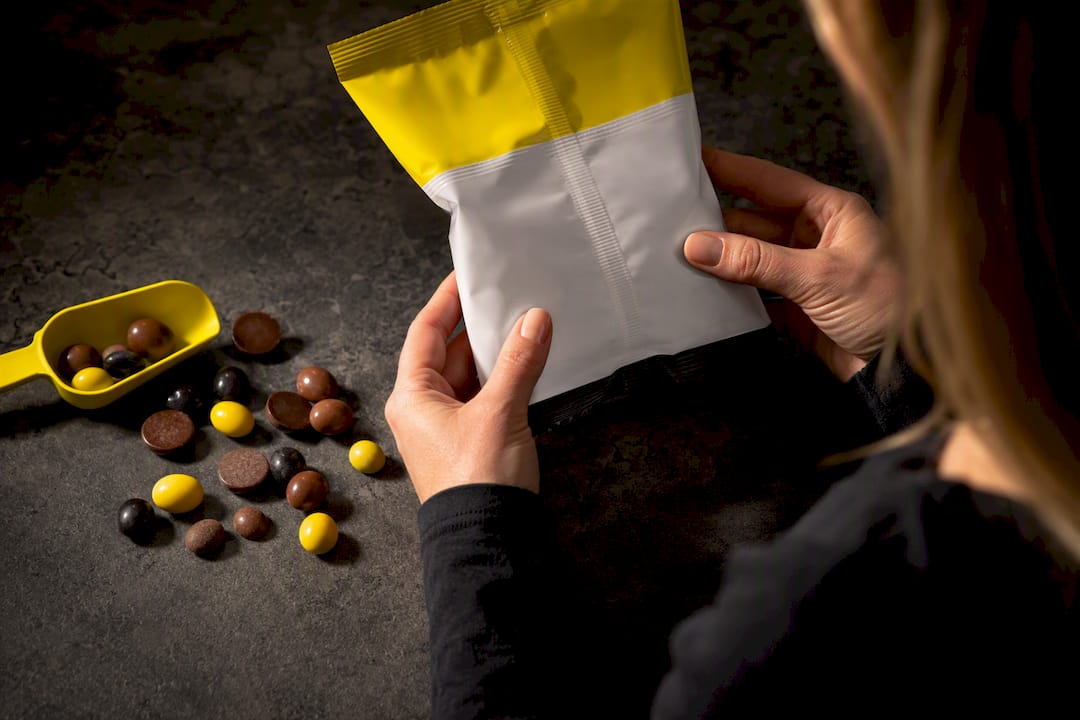 Shopper checking candy ingredient panel