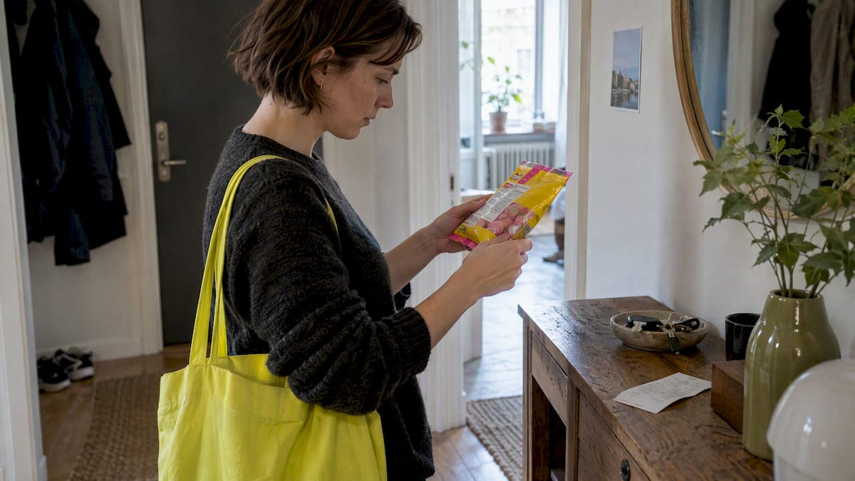 Shopper checking Swedish candy ingredients