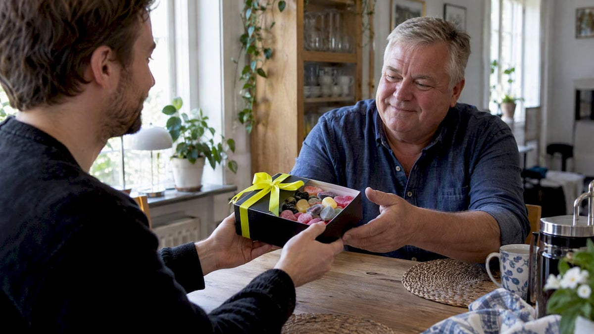Son giving his father Swedish candy